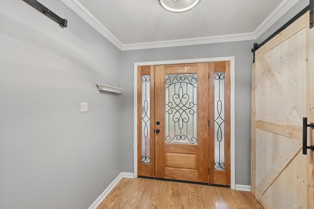 4816 Reynolds Rd, North Richland Hills, TX 76180 - foyer entrance with a barn door, baseboards, light wood-style floors, and crown molding