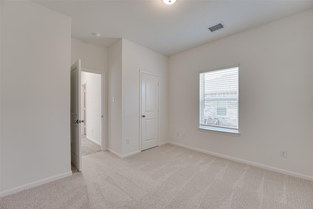 1710 Citrus Dr, Sherman, TX 75092 - unfurnished bedroom featuring light carpet and baseboards