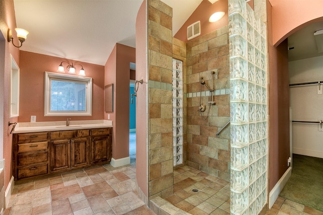 711 Pearl Cv, Oak Point, TX 75068 - full bathroom featuring walk in shower, vanity, and stone finish floors