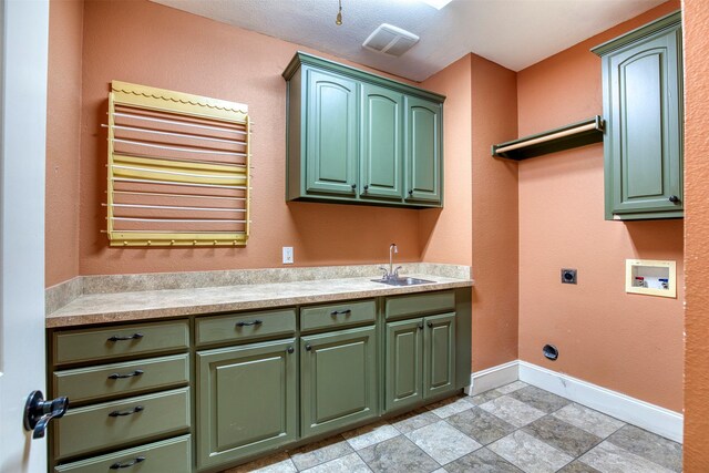 711 Pearl Cv, Oak Point, TX 75068 - laundry area featuring cabinet space, electric dryer hookup, washer hookup, baseboards, and light stone finish floors