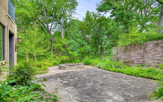 711 Pearl Cv, Oak Point, TX 75068 - view of patio featuring a fire pit