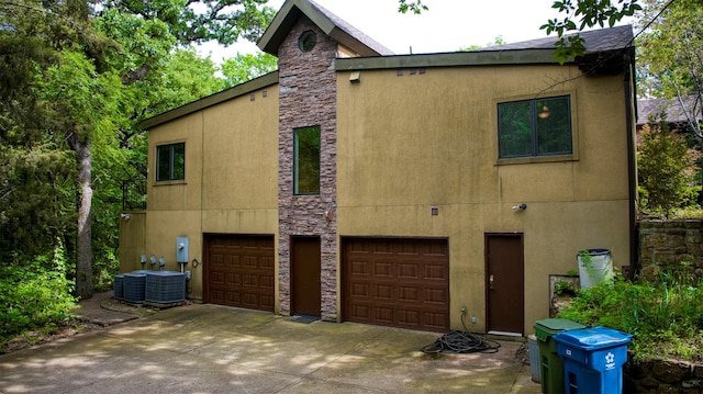 711 Pearl Cv, Oak Point, TX 75068 - view of home's exterior with an attached garage and stucco siding
