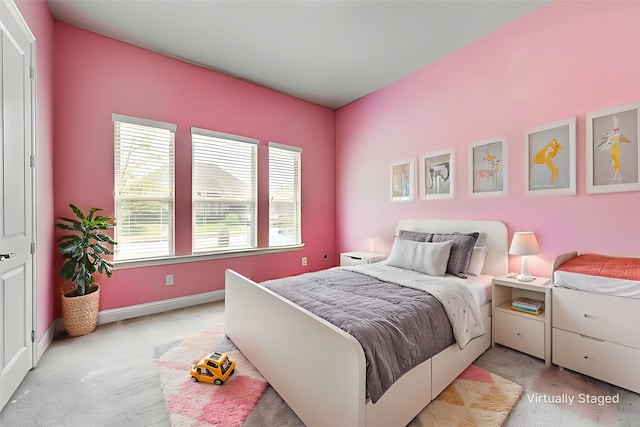 7804 Caddo Cv, Mckinney, TX 75071 - bedroom featuring baseboards and light carpet