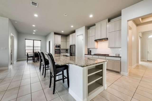 7804 Caddo Cv, Mckinney, TX 75071 - kitchen featuring appliances with stainless steel finishes, a sink, light tile patterned floors, tasteful backsplash, and recessed lighting