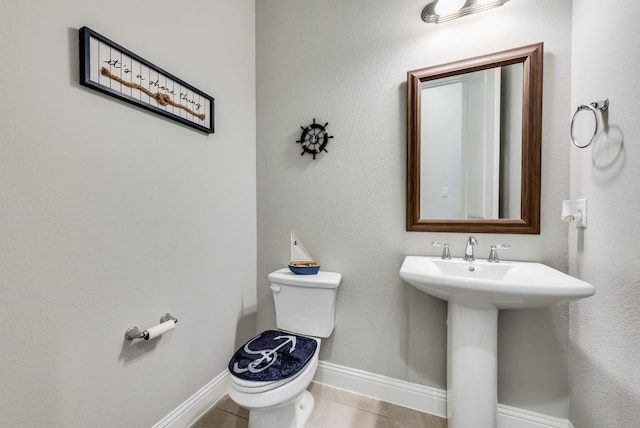7804 Caddo Cv, Mckinney, TX 75071 - bathroom featuring toilet, baseboards, and a sink