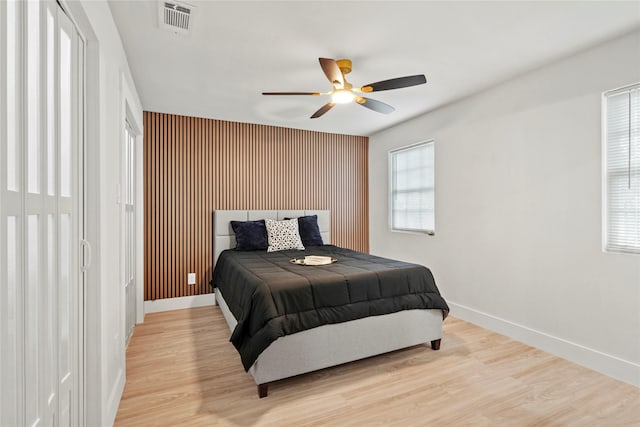 1608 Carolyn St, Irving, TX 75061 - bedroom with baseboards, light wood-style floors, and an accent wall