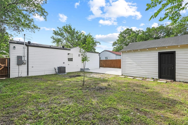 1608 Carolyn St, Irving, TX 75061 - view of yard featuring a patio area, central AC unit, and an outdoor structure