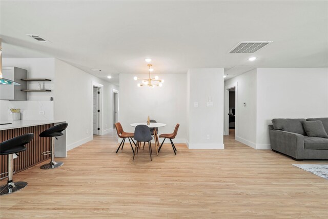 1608 Carolyn St, Irving, TX 75061 - dining area featuring a chandelier, baseboards, light wood finished floors, and recessed lighting