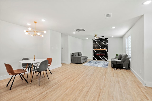 1608 Carolyn St, Irving, TX 75061 - sitting room with light wood-style floors, baseboards, recessed lighting, ceiling fan, and a chandelier