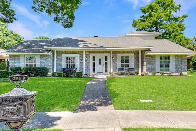2809 Valley Ridge Dr, Richardson, TX 75080 - ranch-style home featuring a front lawn, stone siding, and covered porch