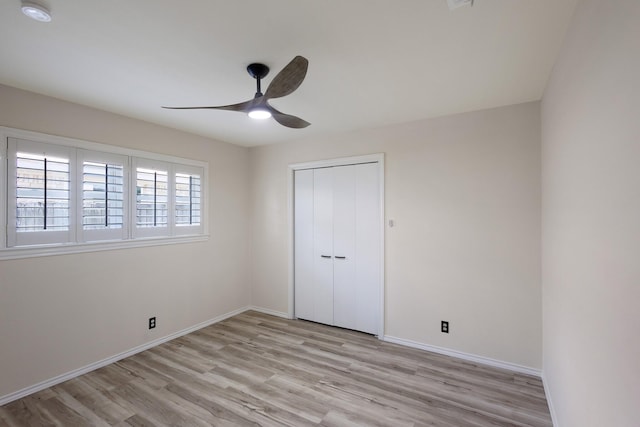 2809 Valley Ridge Dr, Richardson, TX 75080 - unfurnished bedroom featuring light wood finished floors, baseboards, a closet, and ceiling fan