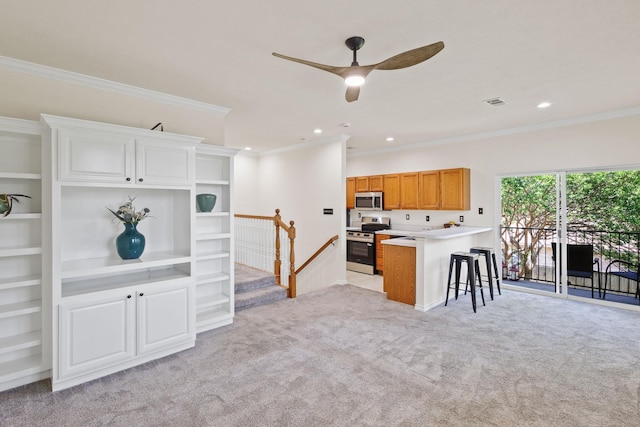 2809 Valley Ridge Dr, Richardson, TX 75080 - kitchen featuring appliances with stainless steel finishes, light colored carpet, a breakfast bar area, a peninsula, and crown molding