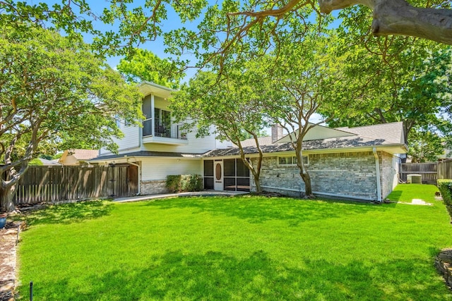 2809 Valley Ridge Dr, Richardson, TX 75080 - back of house featuring brick siding, a sunroom, a chimney, and central AC unit