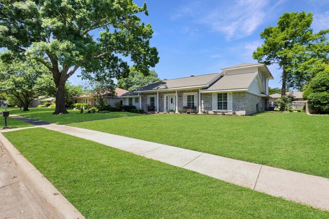 2809 Valley Ridge Dr, Richardson, TX 75080 - single story home featuring a front lawn and roof with shingles