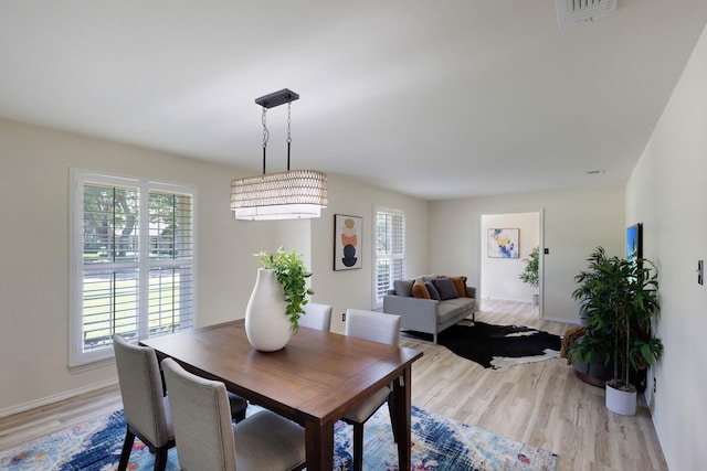 2809 Valley Ridge Dr, Richardson, TX 75080 - dining space featuring plenty of natural light, light wood-style floors, and baseboards