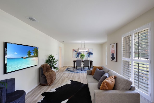 2809 Valley Ridge Dr, Richardson, TX 75080 - living area featuring light wood-style flooring and baseboards