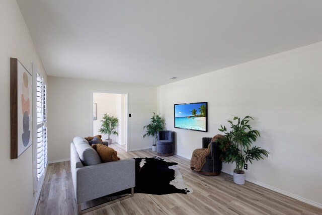 2809 Valley Ridge Dr, Richardson, TX 75080 - living room with light wood-style flooring and baseboards