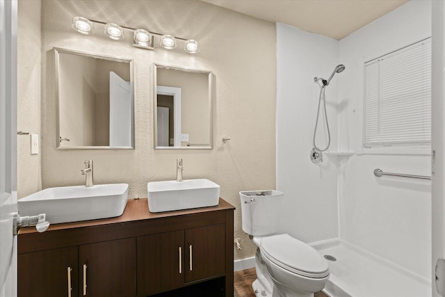 612 S Mills Dr, Euless, TX 76040 - full bathroom featuring a shower, toilet, and double vanity