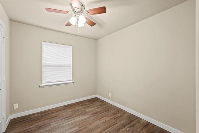 612 S Mills Dr, Euless, TX 76040 - unfurnished room with dark wood-style flooring, baseboards, and a ceiling fan