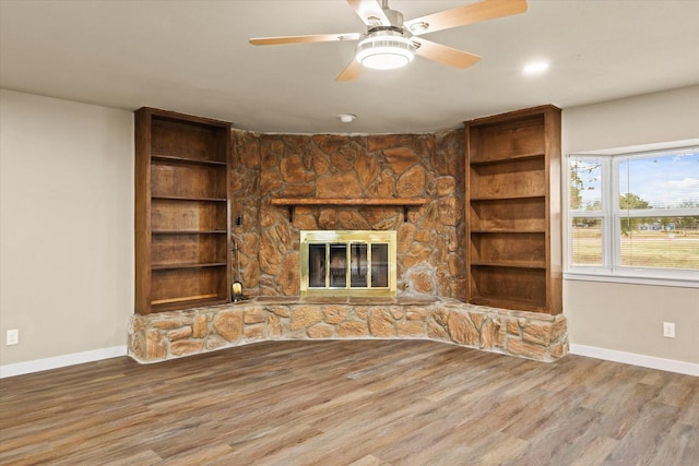 612 S Mills Dr, Euless, TX 76040 - unfurnished living room featuring baseboards, wood finished floors, a fireplace, and ceiling fan