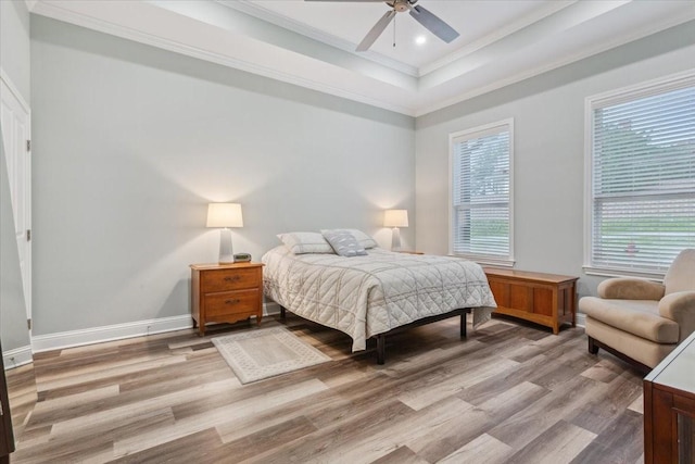 207 Merrifield Dr, Woodway, TX 76712 - bedroom with ornamental molding, wood finished floors, baseboards, recessed lighting, and a tray ceiling