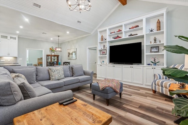207 Merrifield Dr, Woodway, TX 76712 - living area with a chandelier, recessed lighting, light wood-style floors, and built in features