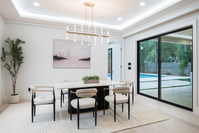 4326 Merrell Rd, Dallas, TX 75229 - dining area featuring a raised ceiling, light wood-style floors, and recessed lighting