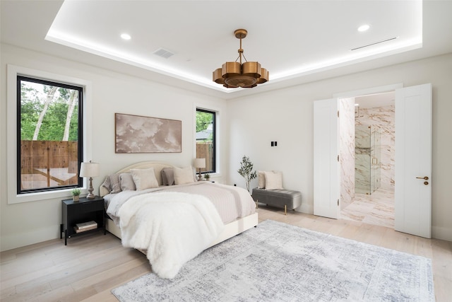 4326 Merrell Rd, Dallas, TX 75229 - bedroom with a raised ceiling, light wood-style floors, recessed lighting, and connected bathroom