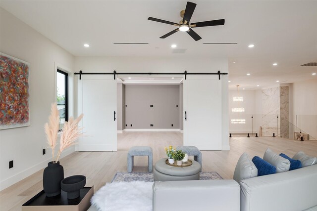 4326 Merrell Rd, Dallas, TX 75229 - living area with a barn door, light wood-type flooring, and recessed lighting