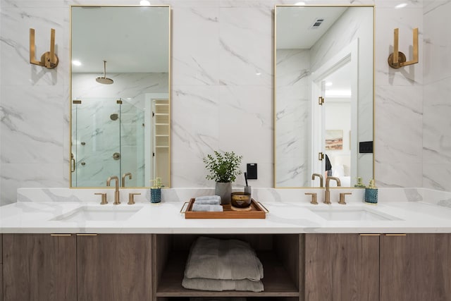 4326 Merrell Rd, Dallas, TX 75229 - bathroom featuring a marble finish shower, tile walls, and vanity