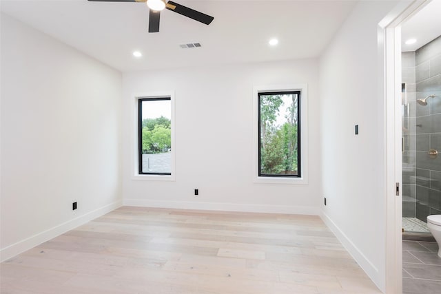 4326 Merrell Rd, Dallas, TX 75229 - unfurnished room featuring plenty of natural light, ceiling fan, light wood-style flooring, recessed lighting, and baseboards