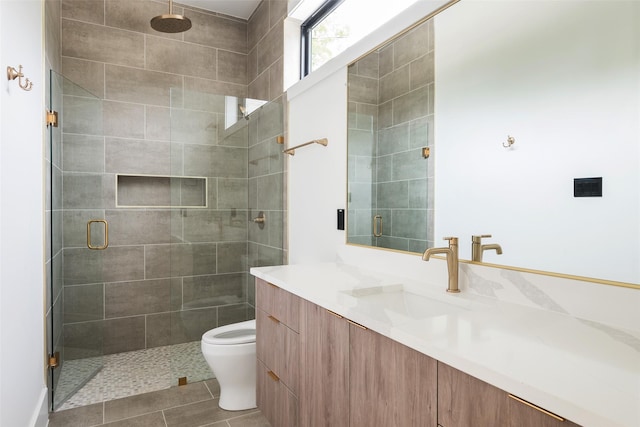 4326 Merrell Rd, Dallas, TX 75229 - bathroom with a shower stall, vanity, toilet, and tile patterned floors