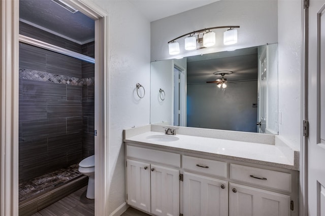 4228 Longleaf Ln, Fort Worth, TX 76137 - full bathroom with toilet, a stall shower, a ceiling fan, and vanity