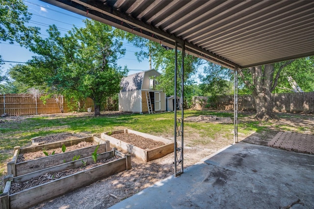 4228 Longleaf Ln, Fort Worth, TX 76137 - view of patio / terrace with a garden, a storage unit, and an outdoor structure