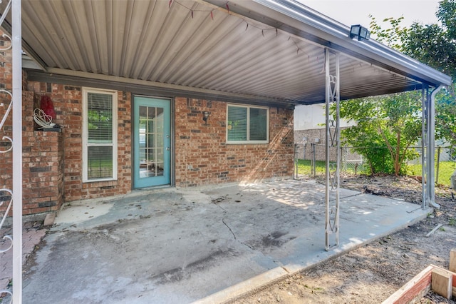 4228 Longleaf Ln, Fort Worth, TX 76137 - view of patio / terrace featuring fence and an attached carport