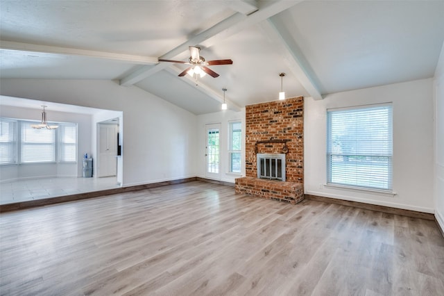 4228 Longleaf Ln, Fort Worth, TX 76137 - unfurnished living room featuring a chandelier, plenty of natural light, wood finished floors, and ceiling fan