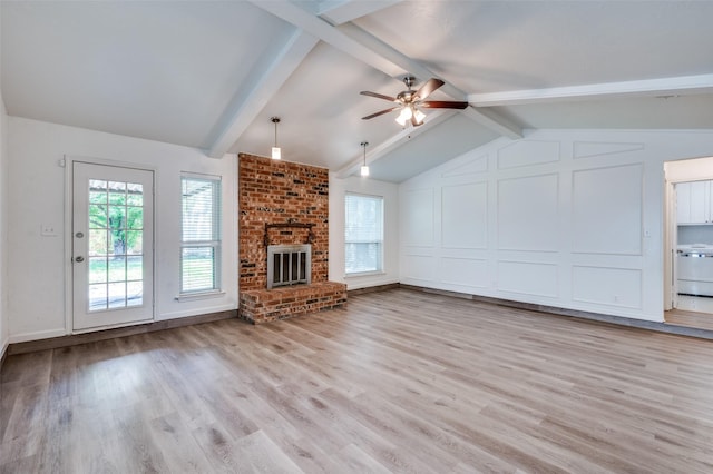 4228 Longleaf Ln, Fort Worth, TX 76137 - unfurnished living room featuring a ceiling fan, light wood finished floors, a fireplace, and washer / dryer