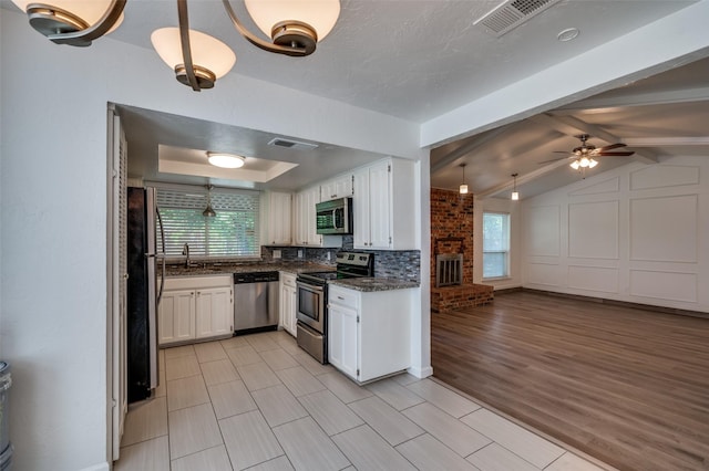 4228 Longleaf Ln, Fort Worth, TX 76137 - kitchen with stainless steel appliances, a sink, and white cabinetry