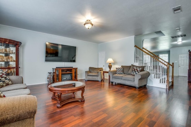 3815 Pinebluff Ln, Rockwall, TX 75032 - living area featuring stairs, wood finished floors, crown molding, and baseboards