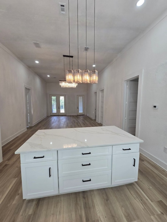109 Anderson Ln, Mabank, TX 75156 - kitchen featuring light wood-style floors, white cabinets, open floor plan, light stone countertops, and crown molding