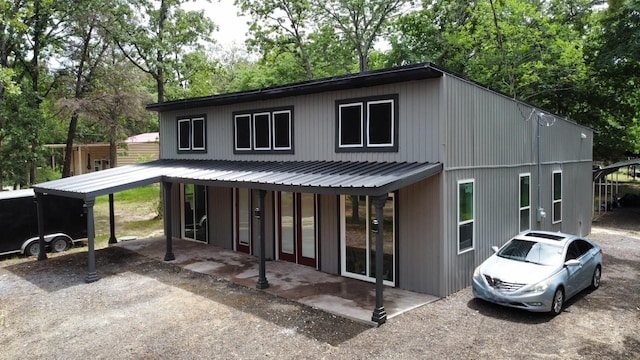 109 Anderson Ln, Mabank, TX 75156 - back of house featuring view of scattered trees and a carport