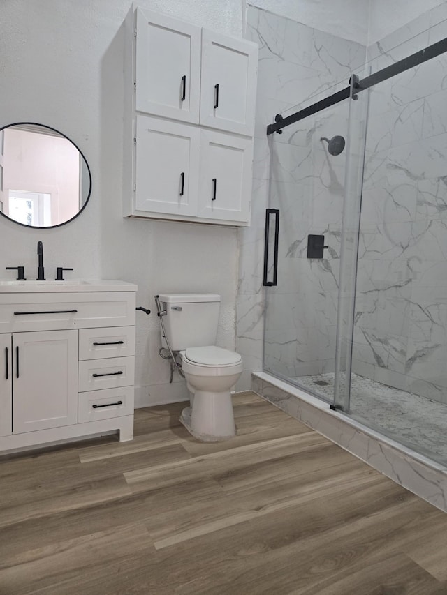 109 Anderson Ln, Mabank, TX 75156 - bathroom featuring toilet, vanity, a marble finish shower, wood finished floors, and baseboards