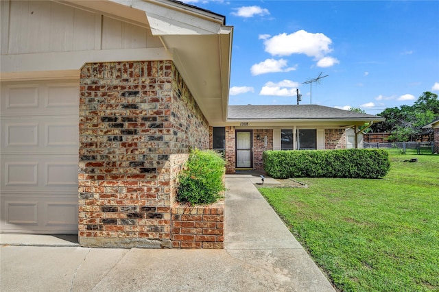 1208 Kay Dr, Weatherford, TX 76086 - property entrance featuring brick siding, a garage, and a shingled roof