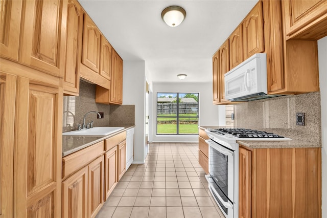 1208 Kay Dr, Weatherford, TX 76086 - kitchen featuring white appliances, a sink, decorative backsplash, light tile patterned floors, and light countertops