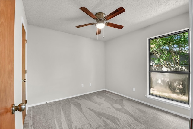 1208 Kay Dr, Weatherford, TX 76086 - spare room featuring ceiling fan, carpet, baseboards, and a textured ceiling