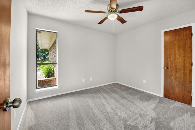 1208 Kay Dr, Weatherford, TX 76086 - carpeted empty room with a ceiling fan, baseboards, and a textured ceiling