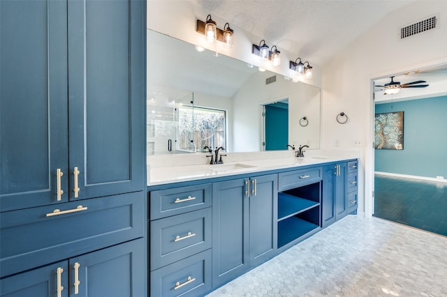 1600 Railhead Pl, Carrollton, TX 75007 - bathroom with lofted ceiling, double vanity, ceiling fan, baseboards, and an enclosed shower