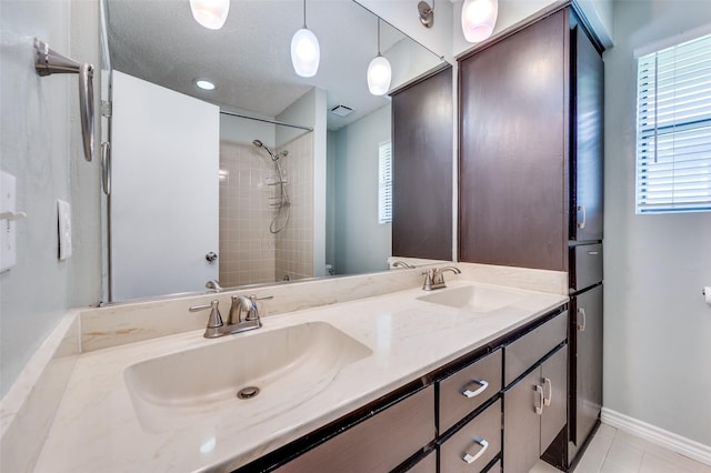 1600 Railhead Pl, Carrollton, TX 75007 - bathroom with healthy amount of natural light, double vanity, a shower, and tile patterned flooring