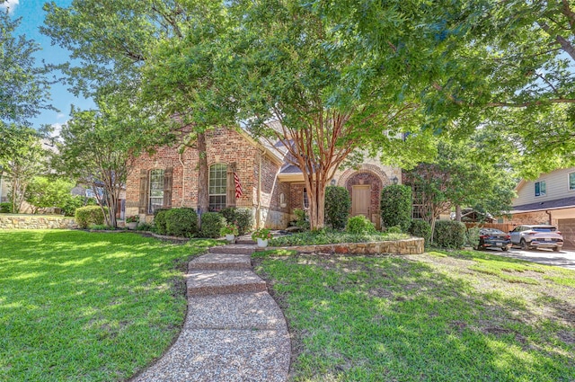 12332 Green Ash Dr, Fort Worth, TX 76244 - view of property hidden behind natural elements featuring brick siding and a front yard