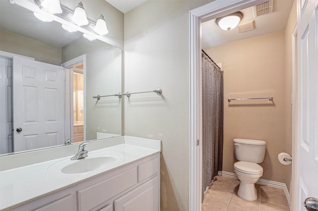 12332 Green Ash Dr, Fort Worth, TX 76244 - full bath featuring toilet, tile patterned floors, vanity, and baseboards